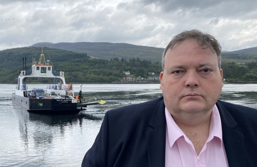 Jamie standing in front of the Mail of Glencoul ferry